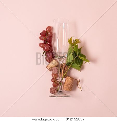 Alphabet. Letter I Made Of Wineglasses With Rose And White Wine, Grapes, Leaves And Corks Lying On P
