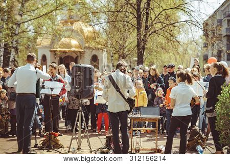 Russia, Siberia, Novokuznetsk - May 9, 2019: Musicians Sing Songs On The Street On Victory Day
