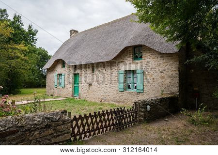 Old House In Saint Lyphard (france) With A Thatched Roof