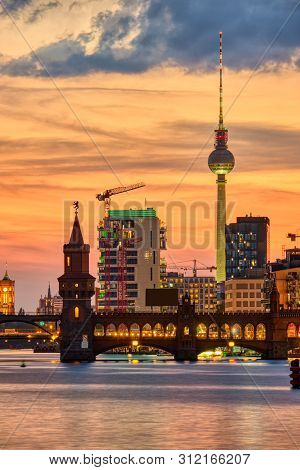 Dramatic Sunset At The Oberbaum Bridge And The Famous Television Tower In Berlin
