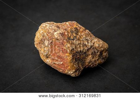 Partly Metamorphic Rock Containing Red, Yellow And White Components