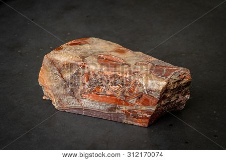 Red Gemstone With Colorful Structure In Many Tones Formed Under High Pressure