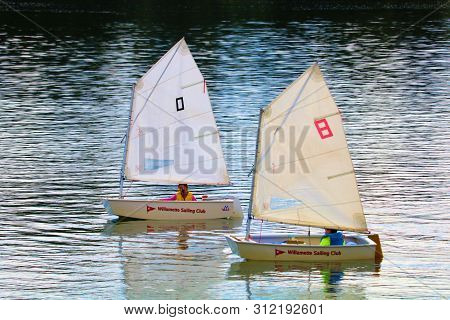 June 28, 2019 In Portland, Or:  People Sailing On Miniature Sail Boats Taken On The Willamette River