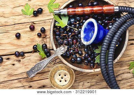 Smoking Oriental Hookah With Currant