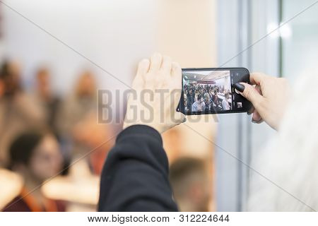 Belarus, Gimel, March 2, 2019. Business Center. Hackathon City.female Hands Hold A Photograph Of A L
