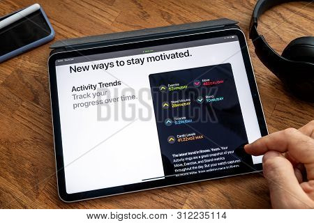 Paris, France - Jun 6, 2019: Man Reading On Apple Ipad Pro Tablet About Latest Announcement Of At Ap