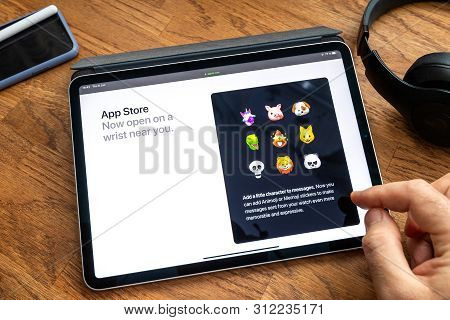 Paris, France - Jun 6, 2019: Man Reading On Apple Ipad Pro Tablet About Latest Announcement Of At Ap