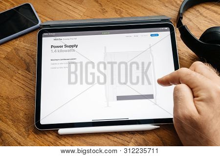 Paris, France - Jun 6, 2019: Man Reading On Apple Ipad Pro Tablet About Latest Announcement Of At De