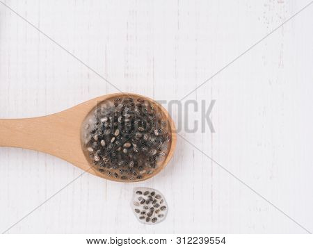 Wet Chia Seeds Or Chia-egg In Wooden Spoon On White Wooden Background. Egg Replacers, Plant Based Eg