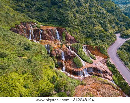 Aerial View Of Golden Waterfall. Nature Landscape Of Jinguashi In Ruifang Area. It Is Located In New