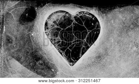 Transparent Heart Trapped In Ice. Cracking, Melting.