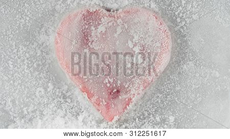 Red Heart In Ice Melting, Looks Like It Is Bleeding. Love - Leaving.