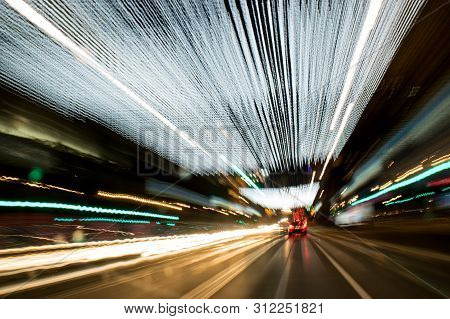 A View Through The Windshield While Driving At Night. Long Exposure. Artistic, Abstract.