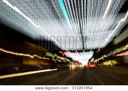 A View Through The Windshield While Driving At Night. Long Exposure. Artistic, Abstract.