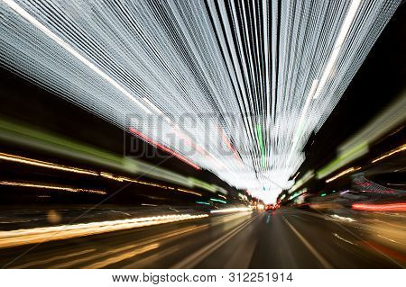 A View Through The Windshield While Driving At Night. Long Exposure. Artistic, Abstract.