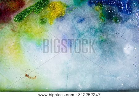 Colored Ice With Glitter, Melting. Multi Color Shining.