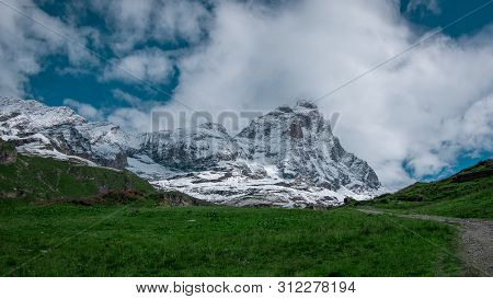 Landscape View Of The South Face Of The Matterhorn, View From Breuil-cervinia.green Meadow In The Fr