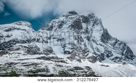 Close Up View Of The South Face Of The Matterhorn, Blue Sky With White Clouds Above. Summer In The P