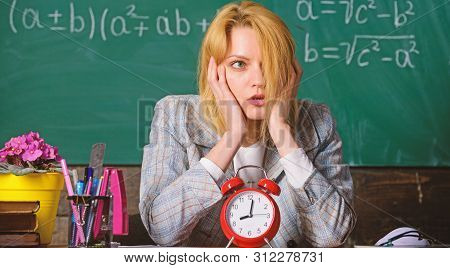 Time Management. Teacher With Alarm Clock At Blackboard. Time. Study And Education. Modern School. K
