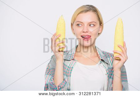 Raw Or Cooked. Agriculture And Cultivation. Corn Crop. Vitamin And Dieting Food. Happy Woman Eating 