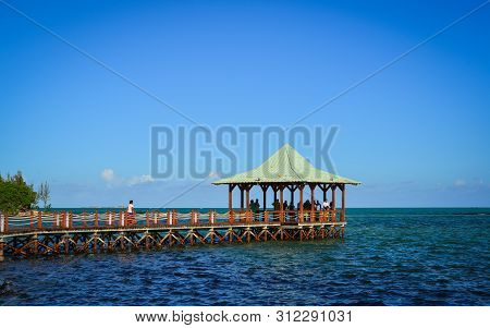 Mahebourg, Mauritius - Jan 3, 2017. People On Wooden Bridge In Mahebourg, Mauritius. Mauritius, An I