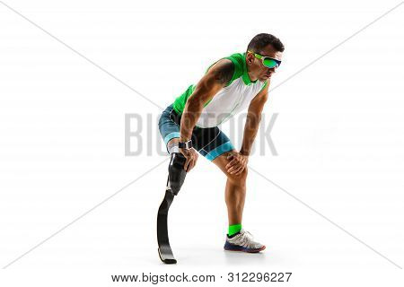 Athlete With Disabilities Or Amputee Isolated On White Studio Background. Professional Male Runner W