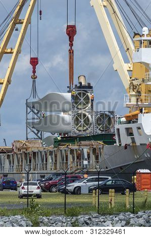 New Bedford, Massachusetts, Usa - July 12, 2019: Workers Readying Wind Turbine Blades For Unloading 