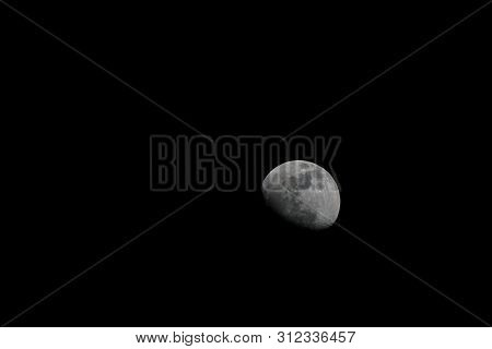 A Photo Of The Moon Taken At Night.
