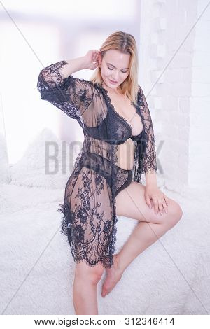 Plus Size Caucasian Woman Dressed In A Beautiful Lace Black Lingerie