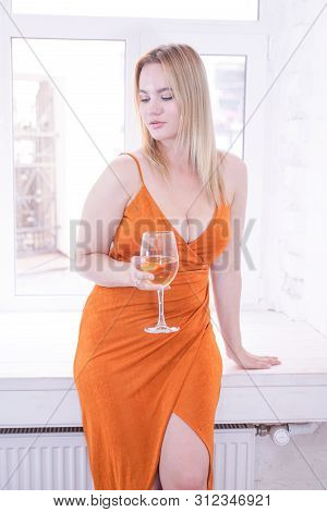 Pretty Plus Size Caucasian Woman Drink Wine In The Morning Alone At Home
