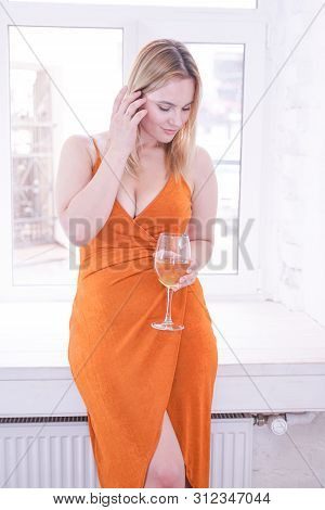 Pretty Plus Size Caucasian Woman Drink Wine In The Morning Alone At Home