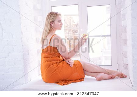Pretty Plus Size Caucasian Woman Drink Wine In The Morning Alone At Home