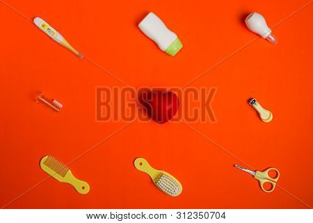 Healthcare Accessories For Newborn On Red Background, Flat Lay