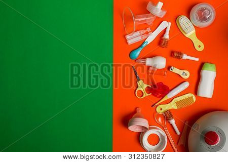 Pediatric Micro-enemas And Newborn Grooming Accessories On Orange Background