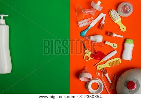 Top View Of Nursing Essentials With Red Pacifier