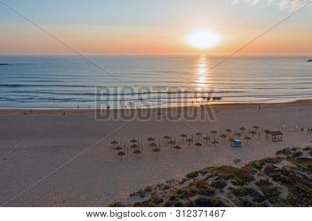 Aerial from Praia do Amado at the west coast in Portugal at sunset