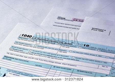 Tax Form 1040, Schedule D, 1040a On A White Background