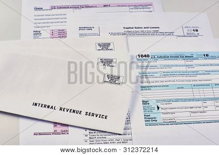 Three Mails From The Internal Revenue Service Lie On 1040, Schedule D Form 1040 And 1040a Tax Forms