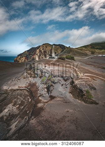 View Over Capelinhos Volcano, Lighthouse Of Ponta Dos Capelinhos On Western Coast On Faial Island, A