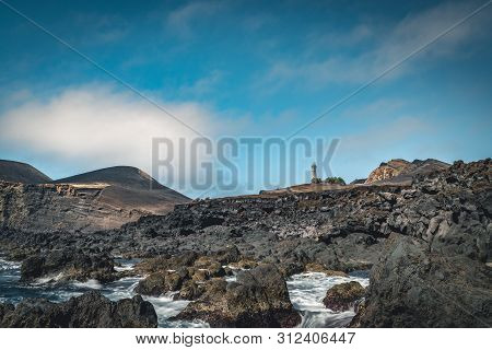View Over Capelinhos Volcano, Lighthouse Of Ponta Dos Capelinhos On Western Coast On Faial Island, A