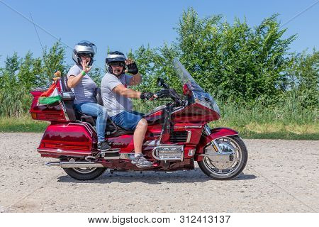 Eger, Hungary - July 04, 2019: Motor Bikers At Red Honda Goldwing Making A Drive Through Hungary Bet