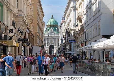 Vienna, Austria - July 20, 2019: Large Group Of Tourists Like To Visit The Pedestrian Zone Kohlmarkt