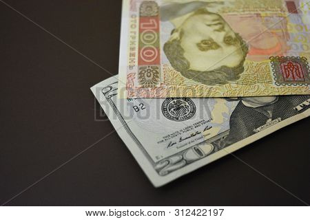 Paper Bills In The Size Of Usd 20 $ Twenty American Dollars And Uah 100 One Hundred Ukrainian Hryvni