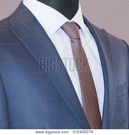 Mans Suit: Jacket, Shirt & Tie Isolated On A Mauve Background. Business Style. Elegant Clothes. Men 