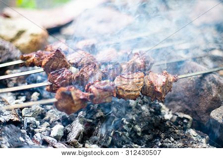 Grilled Shish Kebab On Skewer. Roasted Beef Meat Cooked At Barbecue. Traditional Eastern Dish Shashl