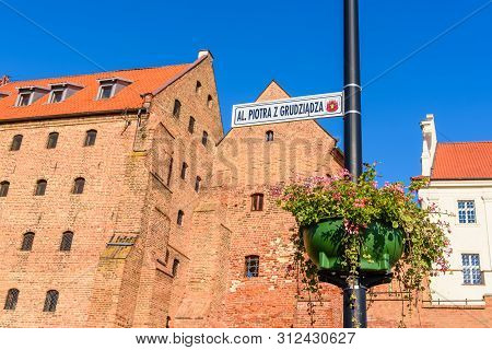 Grudziadz, Poland - July 18, 2019: A Boulevard On The Vistula Along Historical Granaries In Grudziad