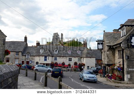 Corfe, England - August 13, 2014: The Village Of Corfe With The 11th Century Castle Above It