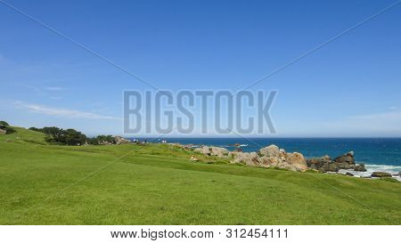 Tanesashi Kaigan Coast. The Coastline Includes Both Sandy And Rocky Beaches, And Grassy Meadows Scen
