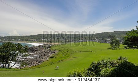 Tanesashi Kaigan Coast. The Coastline Includes Both Sandy And Rocky Beaches, And Grassy Meadows Scen