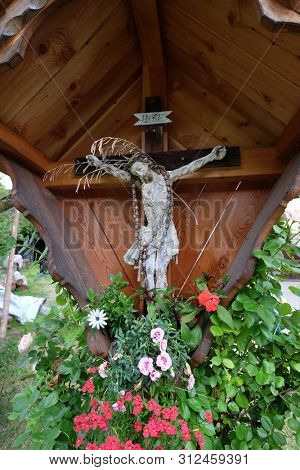PETSCHIED, ITALY - JULY 14, 2018: Crucifixion in Petschied village near Luson, Northern Italy